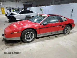 1986 Pontiac Fiero z VIN N0V1NF0R44486165, wystawiony jako Copart lot #44486165 z przebiegiem Nie podano mil oraz Nie do naprawy. Historia ofert i sprzedaży dostępna na DreamBid. Obrazek 1.