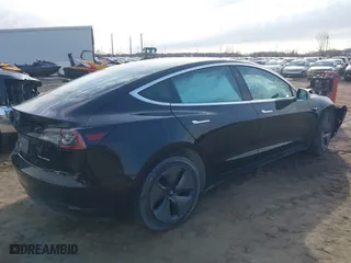 2019 Tesla Model 3 Long Range with VIN 5YJ3E1EB5KF414748, listed as a IAAI auction lot 41778914 with 0 mi miles. Bid and sale history available at carsss.com. Image 4.