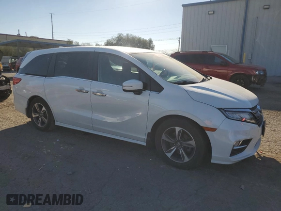 2020 Honda Odyssey Touring with VIN 5FNRL6H8XLB007622, listed as a Copart auction lot 76297494 with 83,452 mi miles and Salvage Title. Bid and sale history available at DreamBid. Image 4.