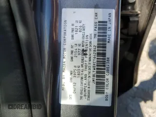 2012 Mazda 3 i Grand Touring with VIN JM1BL1W8XC1642842, listed as a Copart auction lot 57833245 with 104,914 mi miles and Salvage title. Bid and sale history available at DreamBid. Image 12.