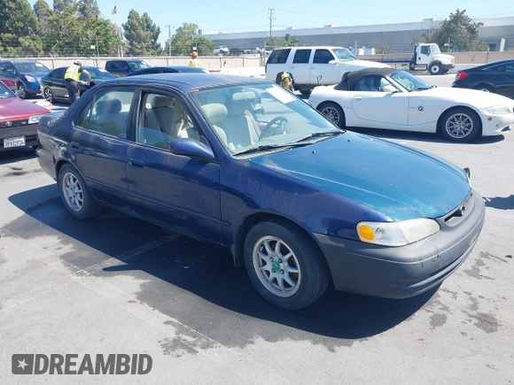 1998 Toyota Corolla VE z VIN 2T1BR18E4WC099280, wystawiony jako IAAI lot #42624278 z przebiegiem 129 901 mil mil oraz . Historia ofert i sprzedaży dostępna na DreamBid. Obrazek 1.
