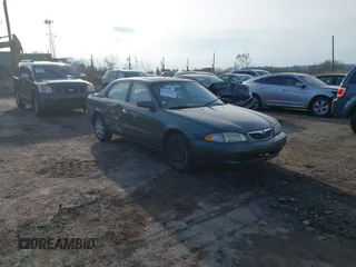 1999 Mazda 626 ES with VIN 1YVGF22C0X5835930, listed as a IAAI auction lot 41666820 with 93,973 mi miles. Bid and sale history available at carsss.com. Image 1.