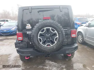 2015 Jeep Wrangler Unlimited Rubicon Hard Rock with VIN 1C4HJWFG9FL569962, listed as a IAAI auction lot 41557801 with 78,597 mi miles. Bid and sale history available at carsss.com. Image 16.