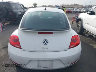 2012 Volkswagen Beetle 2.0T Turbo w/Sun/Snd/Nav PZEV with VIN 3VWVA7ATXCM620731, listed as a IAAI auction lot 41074530 with 99,236 mi miles. Bid and sale history available at carsss.com. Image 16.