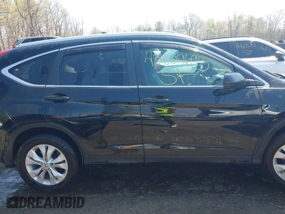 2014 Honda CR-V EX-L with VIN 2HKRM4H76EH673891, listed as a IAAI auction lot 42009693 with 103,798 mi miles. Bid and sale history available at carsss.com. Image 13.