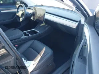 2024 Tesla Model Y Long Range with VIN 7SAYGDEEXRA216186, listed as a IAAI auction lot 41106653 with 25,331 mi miles and . Bid and sale history available at DreamBid. Image 5.