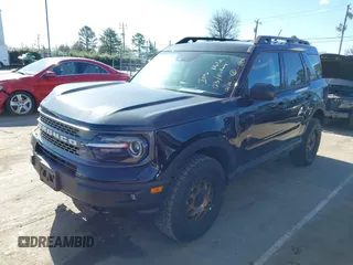 2023 Ford Bronco Sport Badlands z VIN 3FMCR9D95PRD26169, wystawiony jako IAAI lot #41723643 z przebiegiem 21 181 mil mil oraz . Historia ofert i sprzedaży dostępna na DreamBid. Obrazek 2.