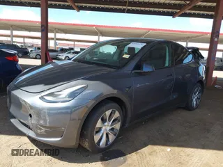 2023 Tesla Model Y Long Range with VIN 7SAYGDEE4PF875915, listed as a IAAI auction lot 42095178 with 11,928 mi miles and . Bid and sale history available at DreamBid. Image 2.