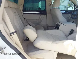 2012 Volkswagen Touareg Sport with VIN WVGEF9BP5CD007294, listed as a IAAI auction lot 41841268 with 160,883 mi miles and . Bid and sale history available at DreamBid. Image 8.