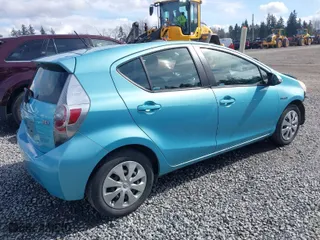 2013 Toyota Prius c One with VIN JTDKDTB31D1049603, listed as a IAAI auction lot 41831397 with 110,480 mi miles. Bid and sale history available at carsss.com. Image 4.