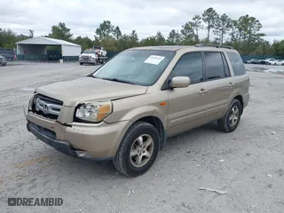 2006 Honda Pilot EX-L with VIN 5FNYF28566B010295, listed as a IAAI auction lot 41654433 with 302,539 mi miles. Bid and sale history available at carsss.com. Image 2.