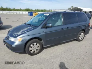 2004 Honda Odyssey EX with VIN 5FNRL18604B034380, listed as a Copart auction lot 48363975 with 148,232 mi miles and Salvage Title. Bid and sale history available at DreamBid. Image 1.