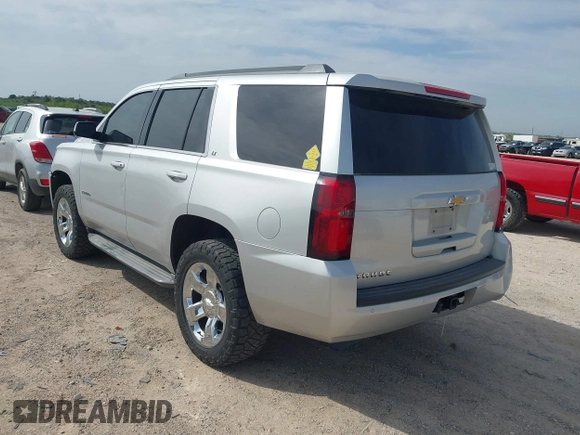 2015 Chevrolet Tahoe LT with VIN 1GNSCBKC9FR111984, listed as a IAAI auction lot 42003685 with 186,391 mi miles and . Bid and sale history available at DreamBid. Image 3.