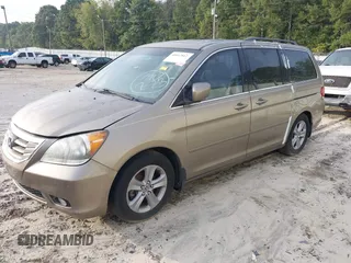 2010 Honda Odyssey Touring with VIN 5FNRL3H9XAB094779, listed as a IAAI auction lot 40412812 with 145,533 mi miles. Bid and sale history available at carsss.com. Image 2.