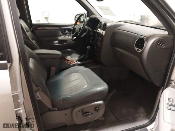2004 GMC Envoy SLE with VIN 1GKDT13S042139622, listed as a IAAI auction lot 40546237 with 168,715 mi miles. Bid and sale history available at carsss.com. Image 5.