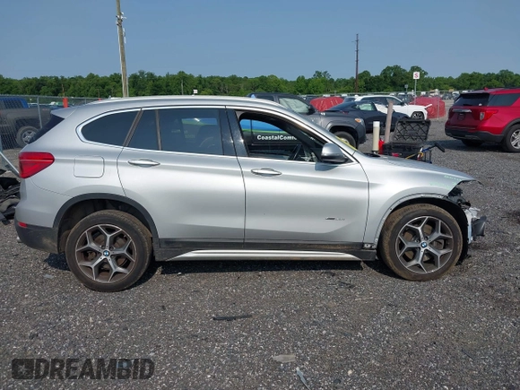2018 BMW X1 xDrive28i with VIN WBXHT3C32J5K23486, listed as a IAAI auction lot 42387208 with 76,115 mi miles and . Bid and sale history available at DreamBid. Image 14.
