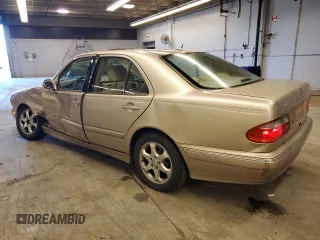 2002 Mercedes-Benz E-Class with VIN WDBJF65J12B485293, listed as a Copart auction lot 77561984 with 140,708 mi miles and Salvage Title. Bid and sale history available at carsss.com. Image 2.