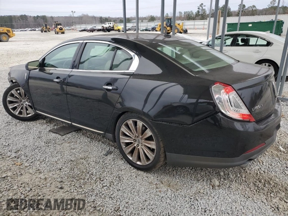 2014 Lincoln MKS EcoBoost z VIN 1LNHL9FT5EG601141, wystawiony jako Copart lot #86497854 z przebiegiem 136 915 mil mil oraz Szkoda całkowita • Salvage title. Historia ofert i sprzedaży dostępna na DreamBid. Obrazek 2.