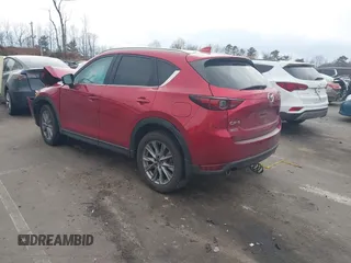 2020 Mazda CX-5 Grand Touring with VIN JM3KFADMXL0842026, listed as a IAAI auction lot 41477339 with 60,755 mi miles. Bid and sale history available at carsss.com. Image 3.