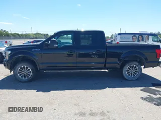 2018 Ford F-150 XL with VIN 1FTFW1EG9JFC63669, listed as a IAAI auction lot 41748012 with 143,584 mi miles. Bid and sale history available at carsss.com. Image 14.