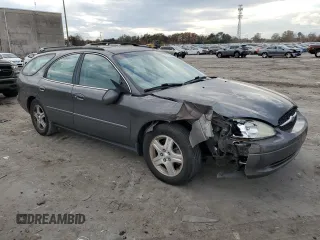 2002 Ford Taurus with VIN 1FAFP59S62A256119, listed as a Copart auction lot 79581164 with 57,128 mi miles and Clean title. Bid and sale history available at DreamBid. Image 4.