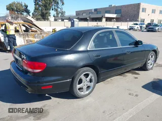 2002 Mazda Millenia S z VIN JM1TA222421728535, wystawiony jako IAAI lot #41525259 z przebiegiem 131 870 mil mil oraz . Historia ofert i sprzedaży dostępna na DreamBid. Obrazek 4.