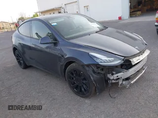 2023 Tesla Model Y Long Range with VIN 7SAYGDEE1PA053683, listed as a IAAI auction lot 42124517 with 32,295 mi miles. Bid and sale history available at carsss.com. Image 1.