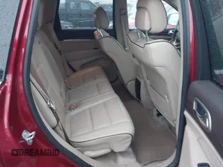 2014 Jeep Grand Cherokee Overland with VIN 1C4RJFCG9EC299235, listed as a IAAI auction lot 41670065 with 108,589 mi miles and . Bid and sale history available at DreamBid. Image 8.