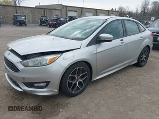 2016 Ford Focus SE with VIN 1FADP3F20GL228831, listed as a IAAI auction lot 42115033 with 106,975 mi miles. Bid and sale history available at carsss.com. Image 2.
