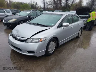 2010 Honda Civic Hybrid with VIN JHMFA3F23AS007725, listed as a IAAI auction lot 42023784 with 230,656 mi miles. Bid and sale history available at carsss.com. Image 2.