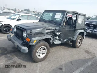 2002 Jeep Wrangler X with VIN 1J4FA39S92P774054, listed as a IAAI auction lot 41470351 with 209,727 mi miles. Bid and sale history available at carsss.com. Image 2.