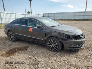 2014 Volkswagen CC VR6 Executive 4Motion with VIN WVWGU7AN9EE523145, listed as a Copart auction lot 71419134 with 94,547 mi miles and Salvage Title. Bid and sale history available at carsss.com. Image 4.