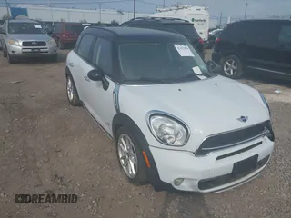 2015 MINI Countryman S with VIN WMWZC5C59FWM18935, listed as a IAAI auction lot 42427878 with 121,410 mi miles and . Bid and sale history available at DreamBid. Image 1.
