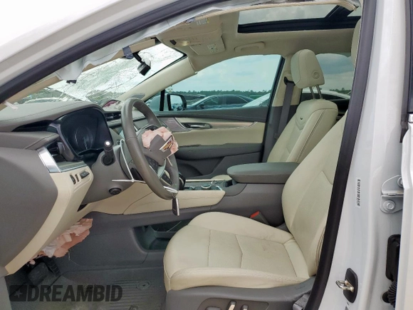 2024 Cadillac XT5 FWD Premium Luxury with VIN 1GYKNCRS9RZ706158, listed as a Copart auction lot 60455055 with 7,999 mi miles and Salvage title. Bid and sale history available at DreamBid. Image 7.