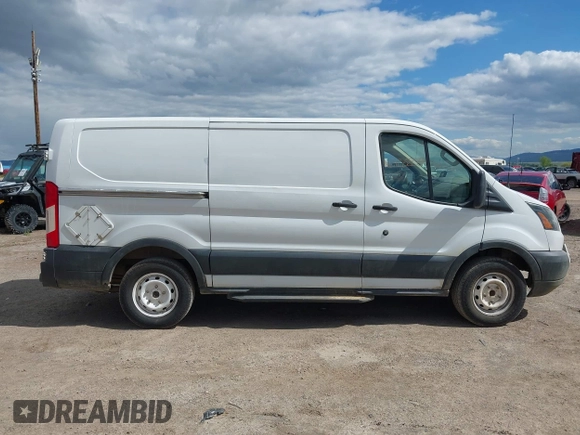 2015 Ford Transit Cargo z VIN 1FTNE1YM7FKB14241, wystawiony jako IAAI lot #42126200 z przebiegiem 314 744 mil mil oraz . Historia ofert i sprzedaży dostępna na DreamBid. Obrazek 14.