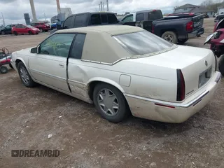2002 Cadillac Eldorado ESC with VIN 1G6EL12Y92B100940, listed as a IAAI auction lot 42094683 with 146,859 mi miles. Bid and sale history available at carsss.com. Image 3.