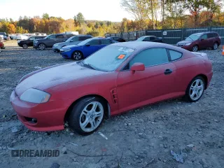 2005 Hyundai Tiburon GT z VIN KMHHN65F35U164178, wystawiony jako Copart lot #76200274 z przebiegiem Nie podano mil oraz Czysty tytuł • Clean title. Historia ofert i sprzedaży dostępna na DreamBid. Obrazek 1.