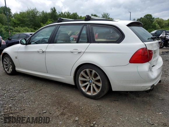 2011 BMW 3 Series 328i xDrive with VIN WBAUU3C5XBA542974, listed as a Copart auction lot 63331535 with 276,912 mi miles and Salvage title. Bid and sale history available at DreamBid. Image 2.
