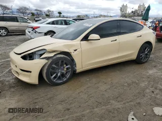 2021 Tesla Model 3 Standard Range Plus with VIN 5YJ3E1EA3MF987562, listed as a Copart auction lot 49013905 with 70,441 mi miles and Salvage Title. Bid and sale history available at DreamBid. Image 1.