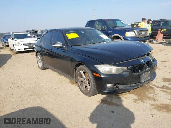 2013 BMW 3 Series 328i with VIN WBA3C1C51DF440679, listed as a IAAI auction lot 41533587 with 184,812 mi miles. Bid and sale history available at carsss.com. Image 1.
