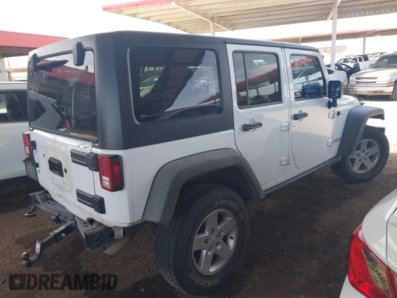 2015 Jeep Wrangler Unlimited Rubicon with VIN 1C4BJWFG9FL744927, listed as a IAAI auction lot 42169740 with 106,352 mi miles and . Bid and sale history available at DreamBid. Image 4.