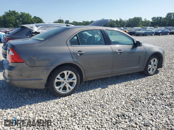 2012 Ford Fusion SE with VIN 3FAHP0HA1CR235996, listed as a Copart auction lot 61243025 with 165,218 mi miles and Salvage title. Bid and sale history available at DreamBid. Image 3.