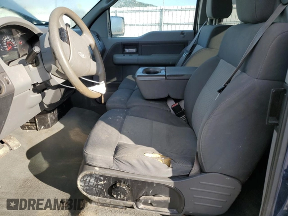 2007 Ford F-150 STX with VIN 1FTRX12W17FA68454, listed as a Copart auction lot 50409485 with 256,600 mi miles and Salvage Title. Bid and sale history available at DreamBid. Image 7.