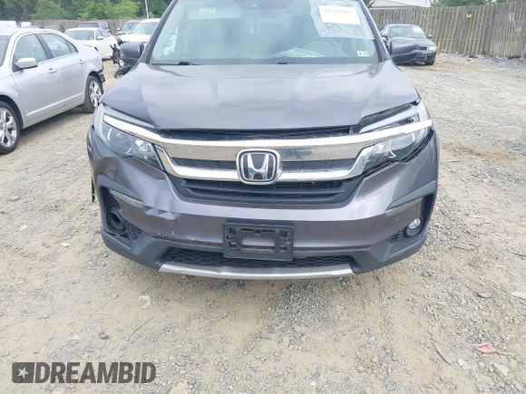 2019 Honda Pilot EX-L with VIN 5FNYF5H45KB018293, listed as a IAAI auction lot 42318481 with 76,617 mi miles and . Bid and sale history available at DreamBid. Image 6.