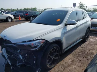 2021 BMW X1 xDrive28i with VIN WBXJG9C02M3M42379, listed as a IAAI auction lot 42476221 with 60,412 mi miles and . Bid and sale history available at DreamBid. Image 18.