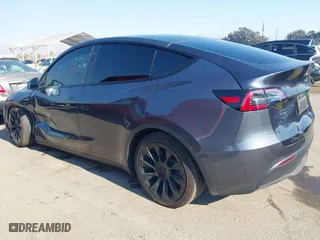 2022 Tesla Model Y Long Range with VIN 7SAYGDEE4NF522698, listed as a IAAI auction lot 41287885 with 82,306 mi miles. Bid and sale history available at carsss.com. Image 3.
