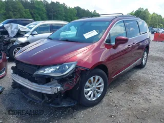 2017 Chrysler Pacifica Touring L with VIN 2C4RC1BG0HR591124, listed as a IAAI auction lot 42138595 with 113,071 mi miles and . Bid and sale history available at DreamBid. Image 2.