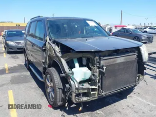 2013 Honda Pilot Touring with VIN 5FNYF3H94DB024069, listed as a IAAI auction lot 42638568 with 190,326 mi miles and . Bid and sale history available at DreamBid. Image 1.