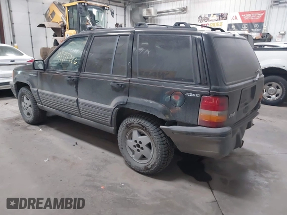 1995 Jeep Grand Cherokee Laredo with VIN 1J4GZ58S6SC765863, listed as a IAAI auction lot 41797726 with 234,715 mi miles and . Bid and sale history available at DreamBid. Image 3.