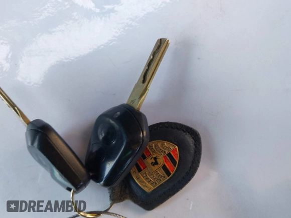 1999 Porsche Boxster with VIN WP0CA2984XU624983, listed as a IAAI auction lot 42722102 with 100,889 mi miles and . Bid and sale history available at DreamBid. Image 11.
